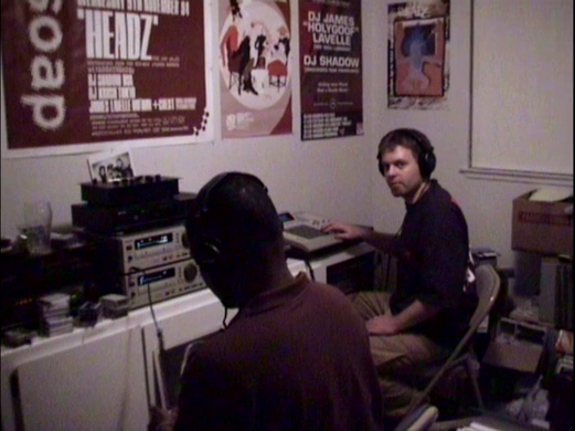 DJ Shadow in studio - note poster for 1993 tour on wall